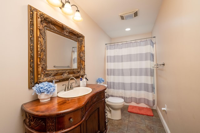 bathroom featuring vanity, toilet, a shower with curtain, and tile patterned flooring