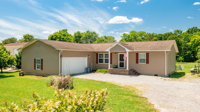 single story home featuring a garage and a front lawn