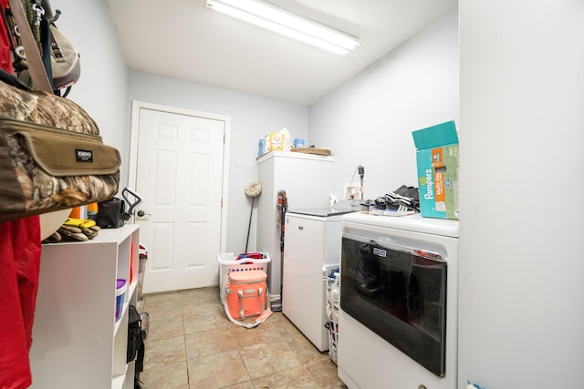 washroom with washing machine and dryer