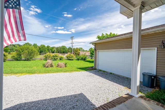 garage with a lawn