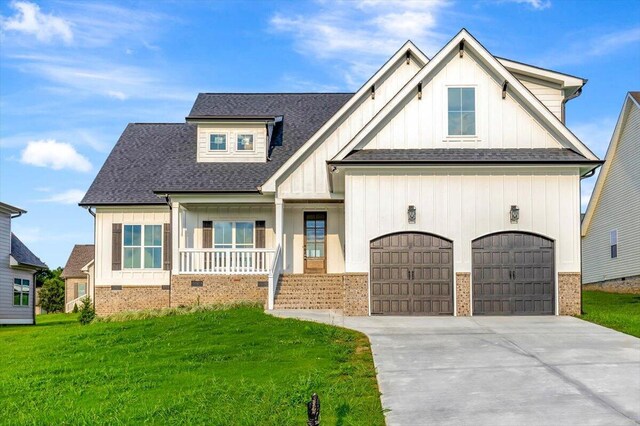 view of front of house with brick siding, crawl space, covered porch, and driveway