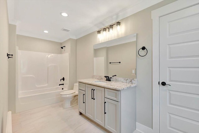 full bathroom with crown molding, vanity, toilet, and  shower combination