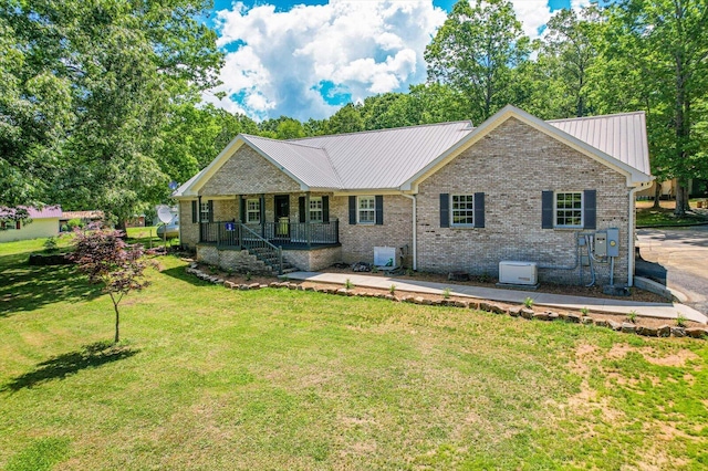 view of front facade with a porch and a front lawn