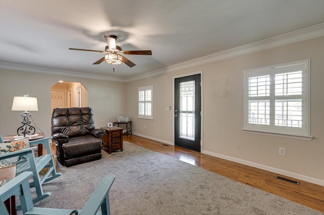 sitting room featuring crown molding, ceiling fan, and hardwood / wood-style flooring