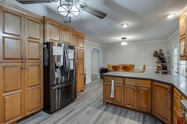 kitchen with stainless steel fridge with ice dispenser, crown molding, ceiling fan, and light hardwood / wood-style floors