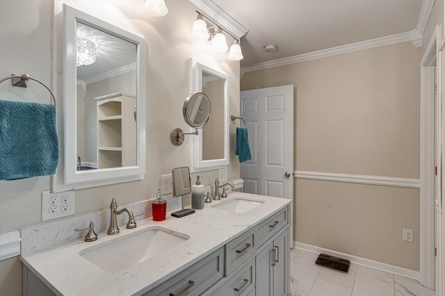 bathroom featuring crown molding and vanity