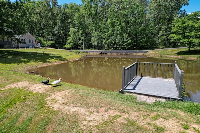 exterior space with a yard and a water view