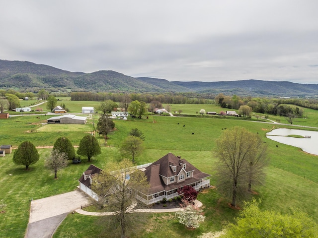 exterior space featuring a rural view and a mountain view