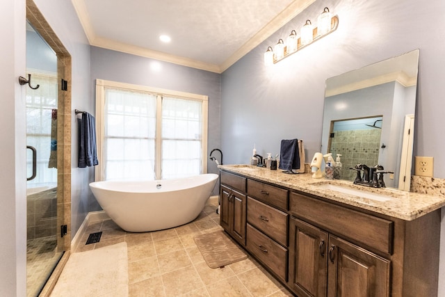 bathroom featuring ornamental molding, a sink, a shower stall, double vanity, and a soaking tub