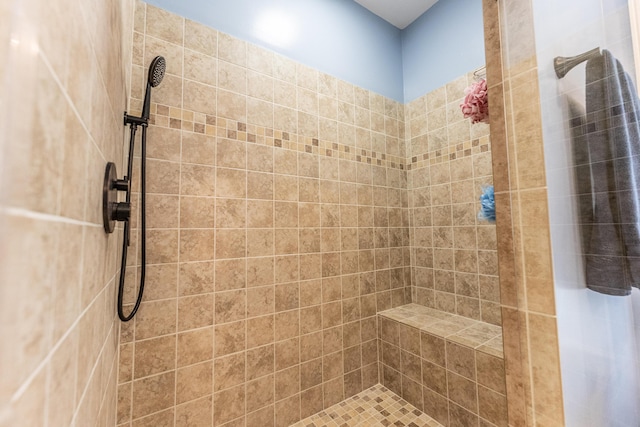 bathroom with tiled shower