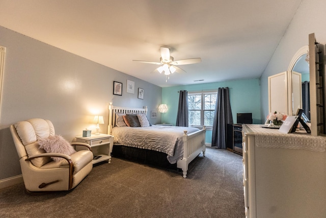 bedroom with baseboards, a ceiling fan, and dark carpet