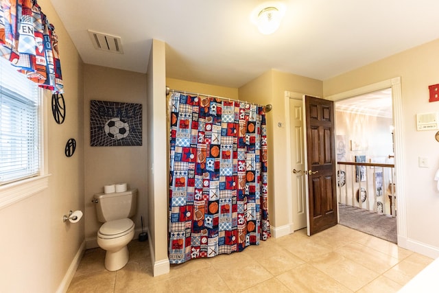 bathroom with tile patterned flooring, visible vents, baseboards, toilet, and a shower with curtain