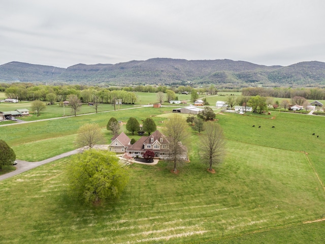 birds eye view of property with a rural view and a mountain view