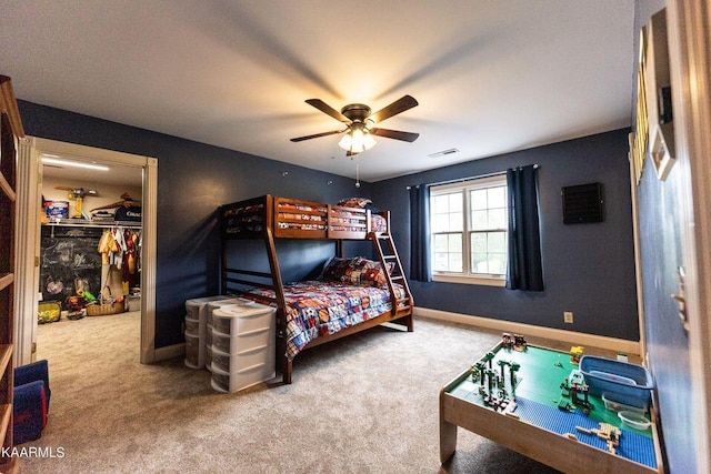 carpeted bedroom featuring visible vents, a ceiling fan, and baseboards