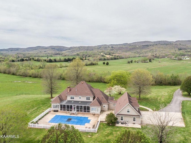 drone / aerial view featuring a rural view and a mountain view