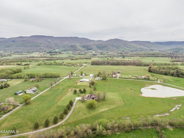 birds eye view of property with a rural view and a mountain view