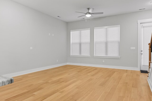 empty room featuring light hardwood / wood-style flooring and ceiling fan