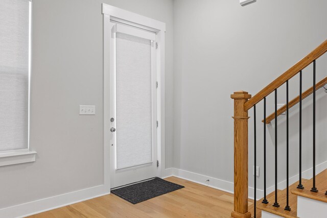 entryway with light hardwood / wood-style floors