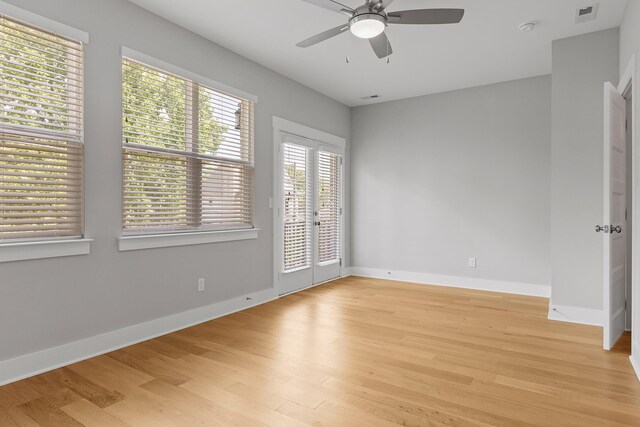 unfurnished room featuring ceiling fan and light hardwood / wood-style floors