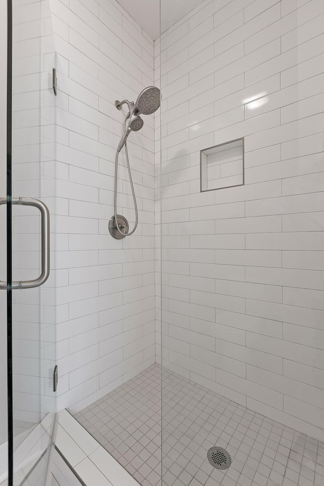 full bath featuring a shower stall