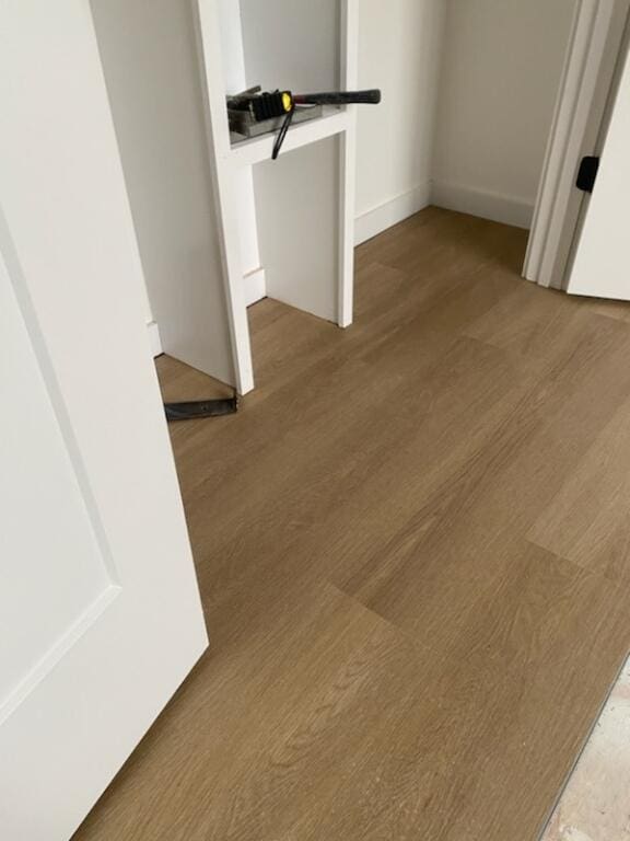 hallway featuring hardwood / wood-style flooring