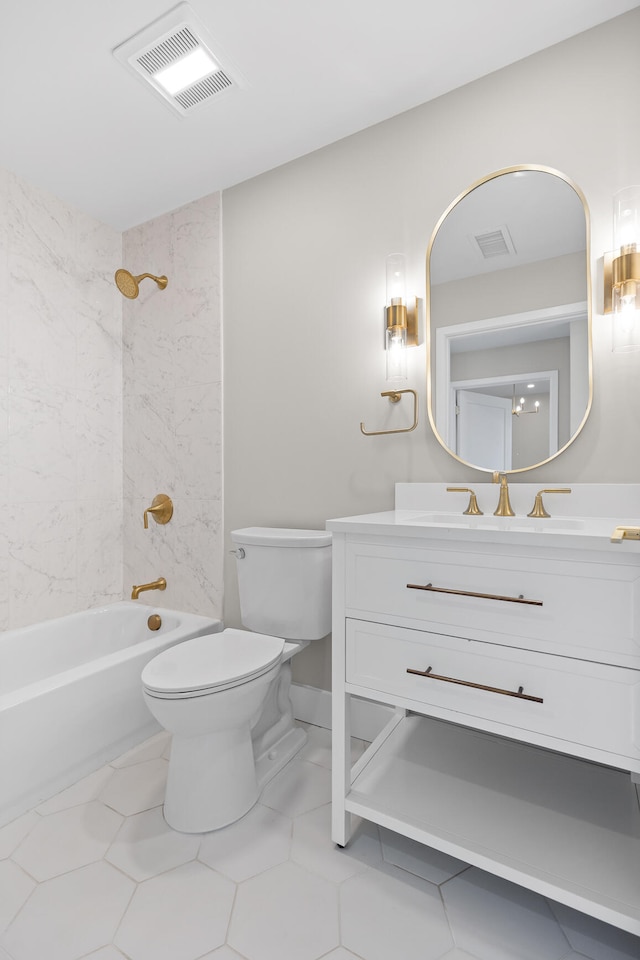 full bathroom featuring vanity, tiled shower / bath combo, tile patterned floors, and toilet