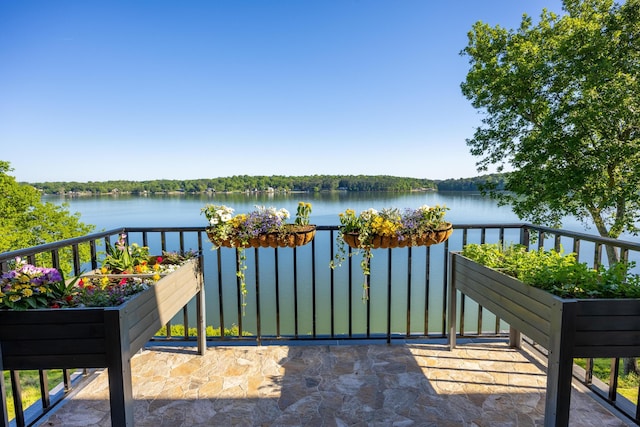 balcony featuring a water view