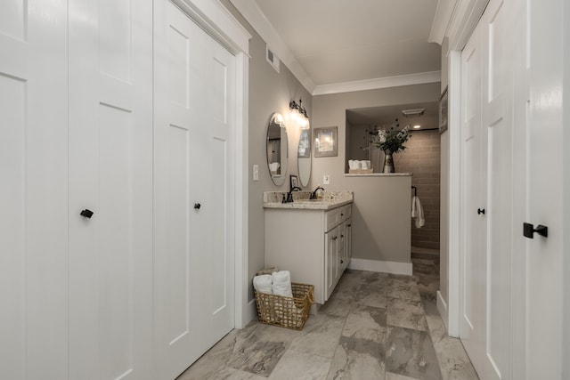 bathroom featuring vanity and ornamental molding