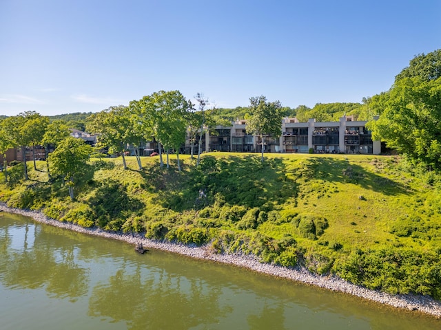 rear view of property with a water view