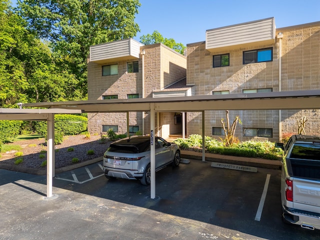 view of vehicle parking with a carport