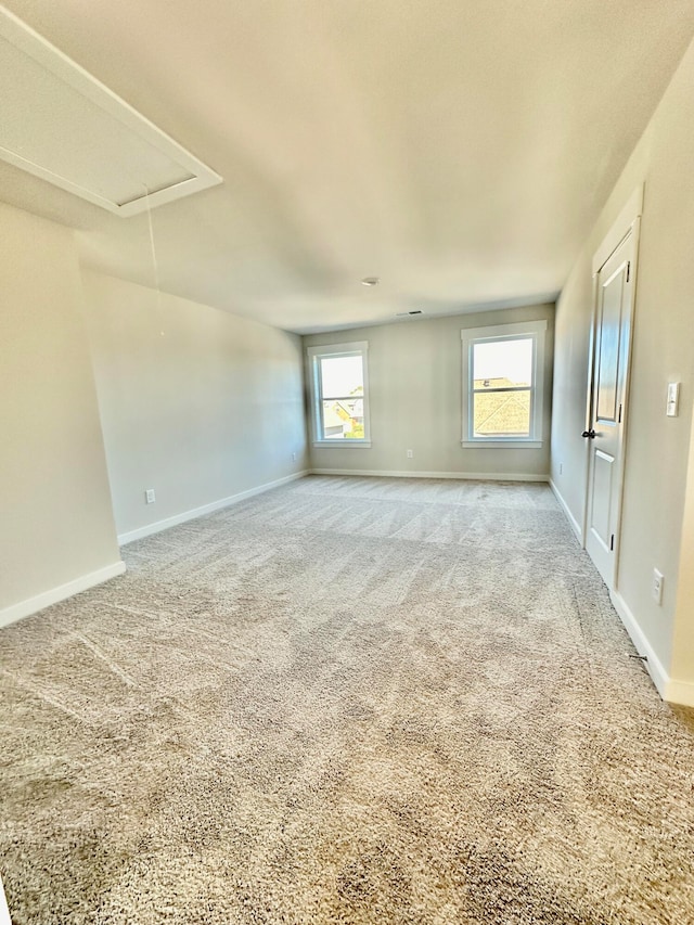 carpeted empty room with a wealth of natural light