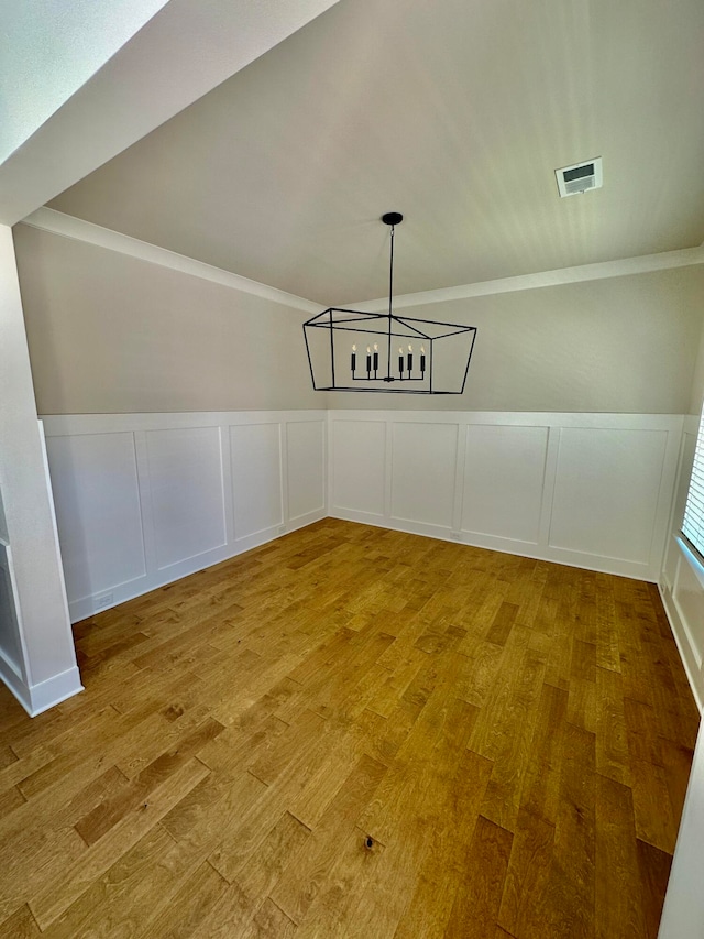 unfurnished dining area featuring hardwood / wood-style flooring