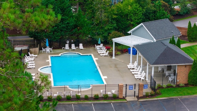 view of swimming pool featuring a patio area