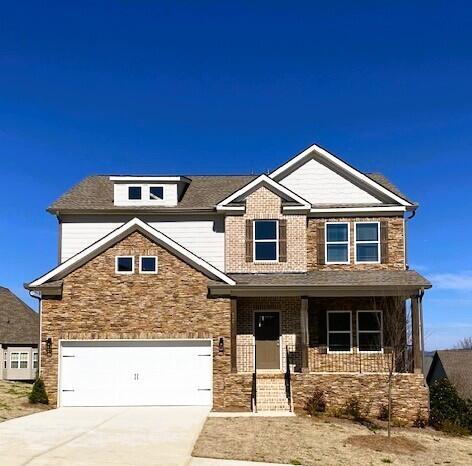 craftsman house with a garage and covered porch