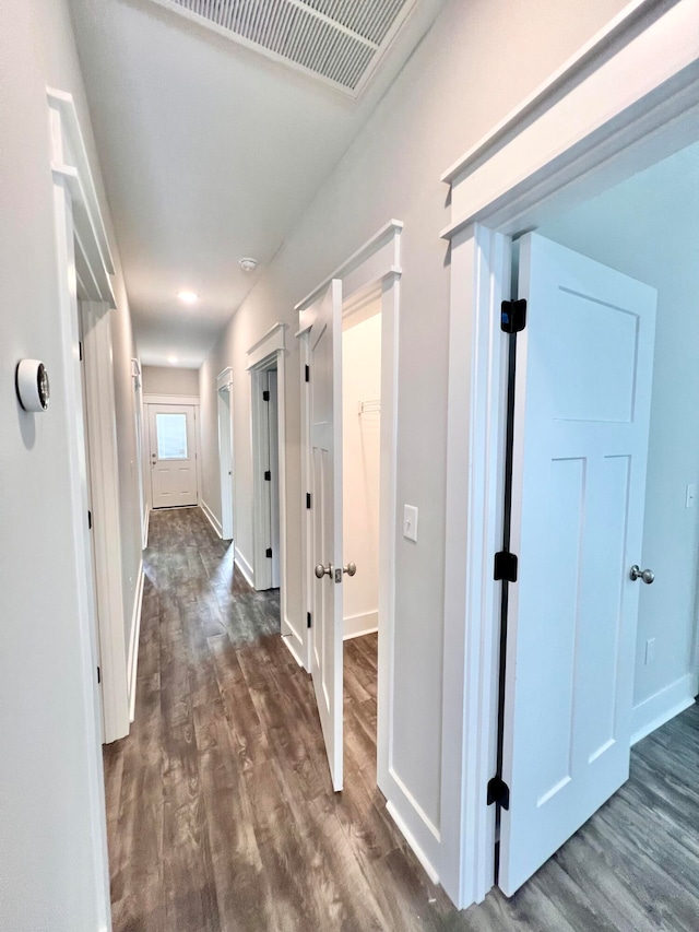 hallway with dark wood-type flooring