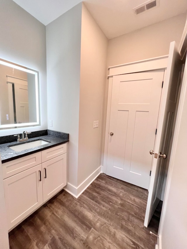 bathroom featuring vanity and hardwood / wood-style floors