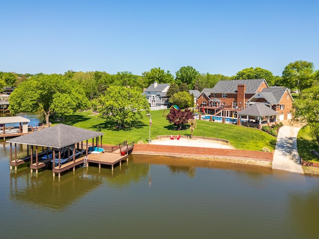 exterior space with a water view, a lawn, and a gazebo