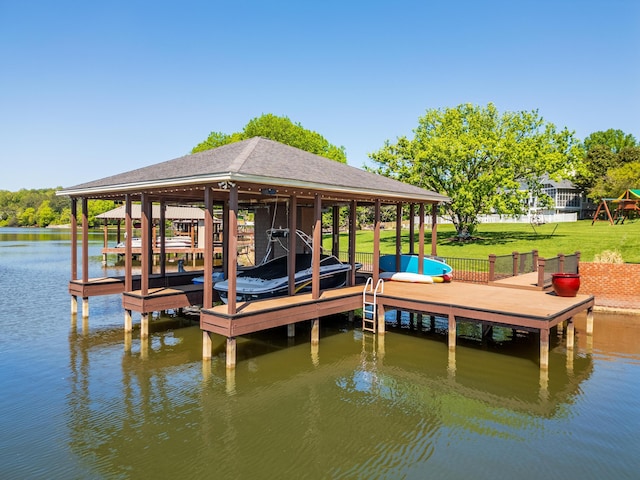 view of dock featuring a lawn and a water view