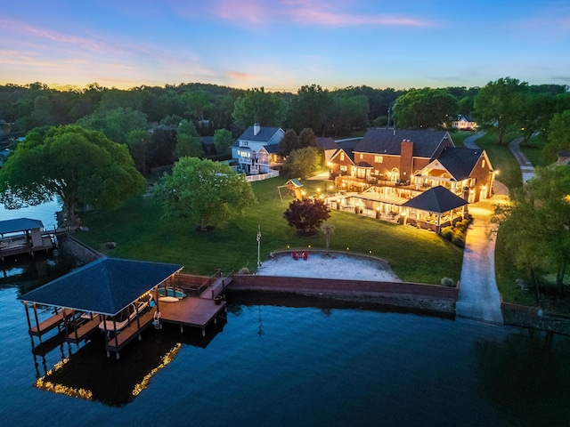 aerial view at dusk with a water view