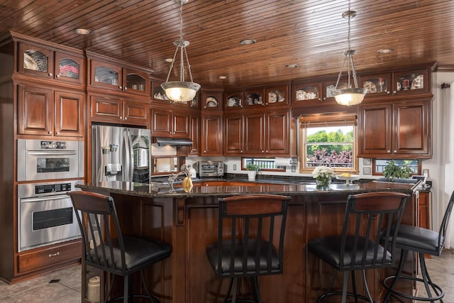 kitchen featuring stainless steel refrigerator with ice dispenser, dark stone counters, a kitchen island, and wood ceiling