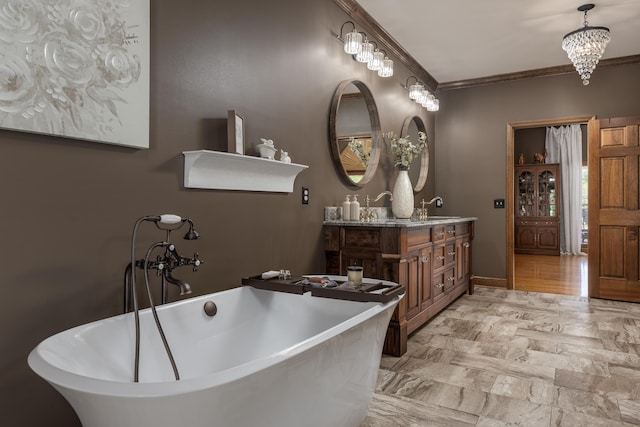 bathroom featuring crown molding, vanity, and a bath