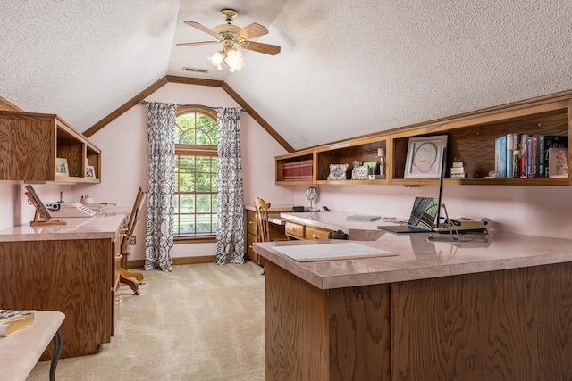 office space with ornamental molding, a textured ceiling, ceiling fan, vaulted ceiling, and light colored carpet