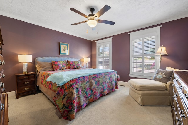 bedroom with a textured ceiling, crown molding, ceiling fan, and light carpet