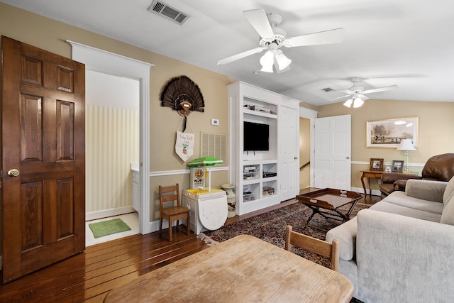 living room featuring lofted ceiling, ceiling fan, and hardwood / wood-style flooring