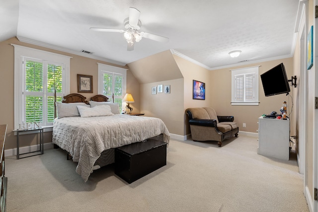 carpeted bedroom featuring ornamental molding, vaulted ceiling, and ceiling fan