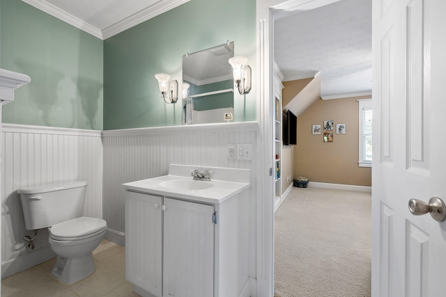 bathroom with ornamental molding, vanity, and toilet