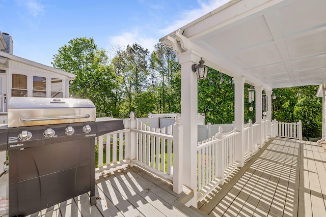 wooden terrace featuring grilling area