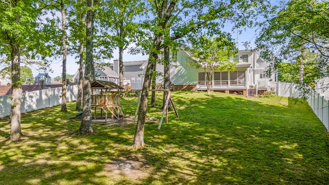 view of yard with a sunroom