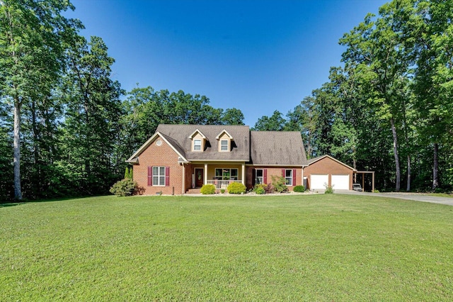 cape cod-style house with a garage and a front yard