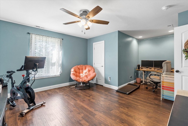 office space featuring dark wood-type flooring and ceiling fan